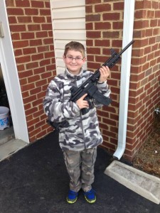 shawn moore son holding personal defense rifle